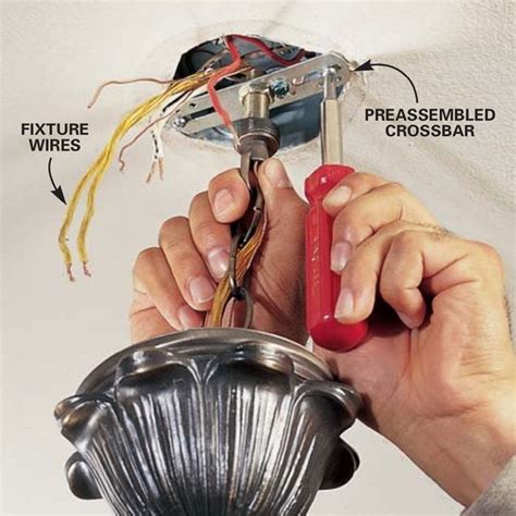 junction box into light fixture|standard light fixture screw size.